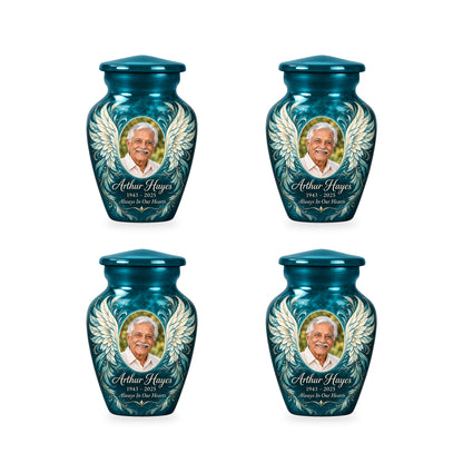 Four matching blue angel wings keepsake urns with sample photo and inscription.