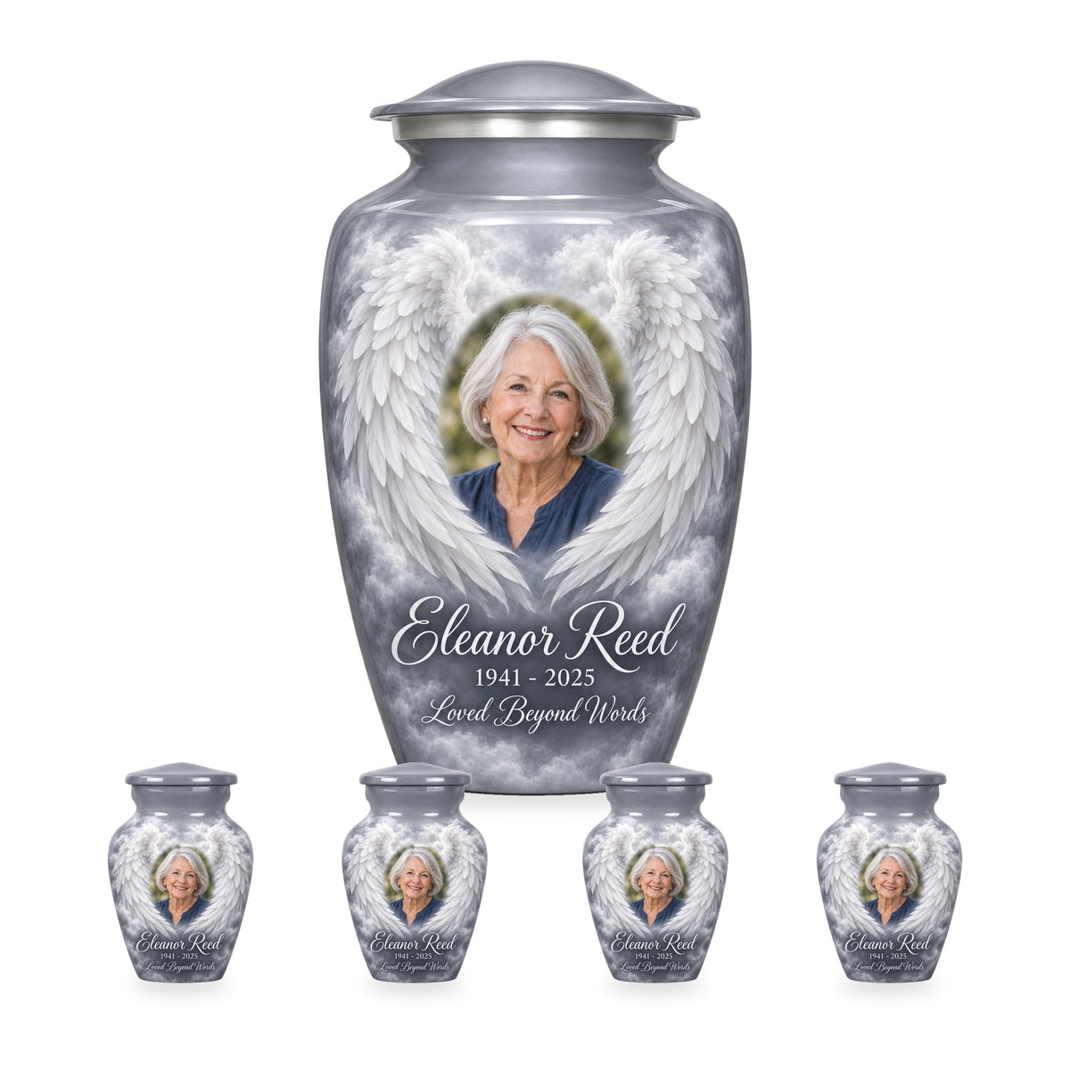 gray adult angel wings urn with four matching keepsakes shown in proportional 10-inch and 3-inch sizes.