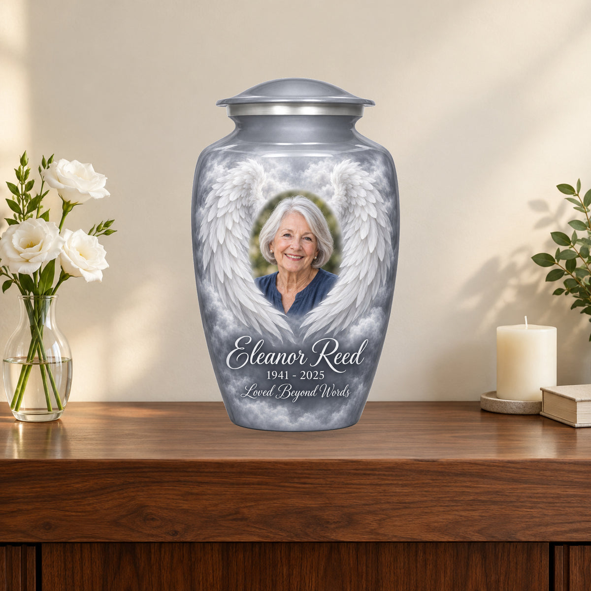 gray personalized angel wings adult urn on a memorial console.