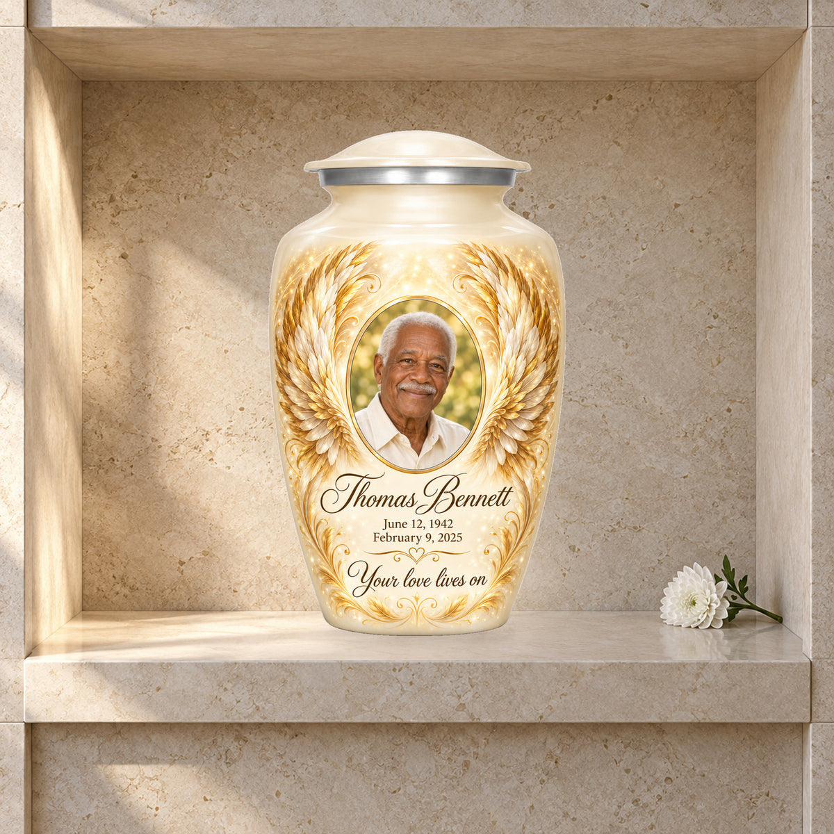 white adult urn with Ivory Golden Wings angel wings artwork displayed in a columbarium niche.