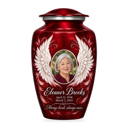 red adult urn with Crimson Uplifted Wings angel wings artwork, fictional sample portrait and personalized inscription on white.