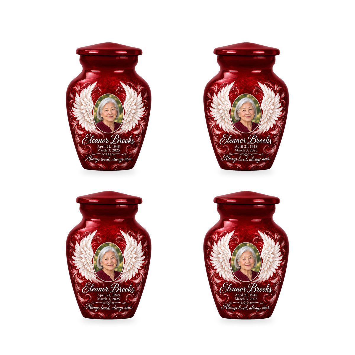 Four matching red angel wings keepsake urns with sample photo and inscription.