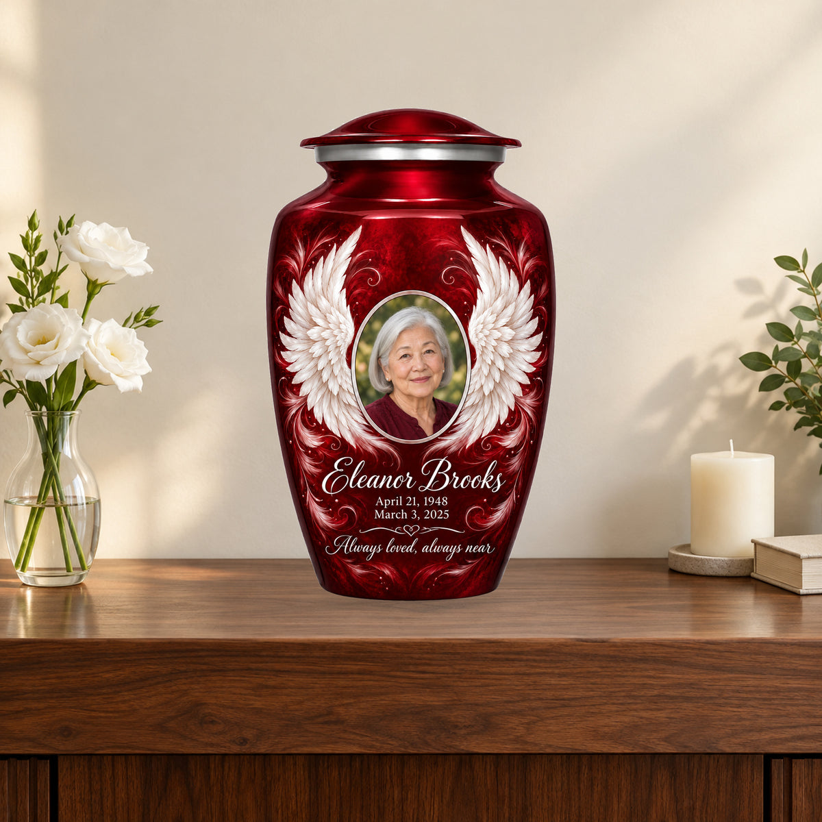 red personalized angel wings adult urn on a memorial console.
