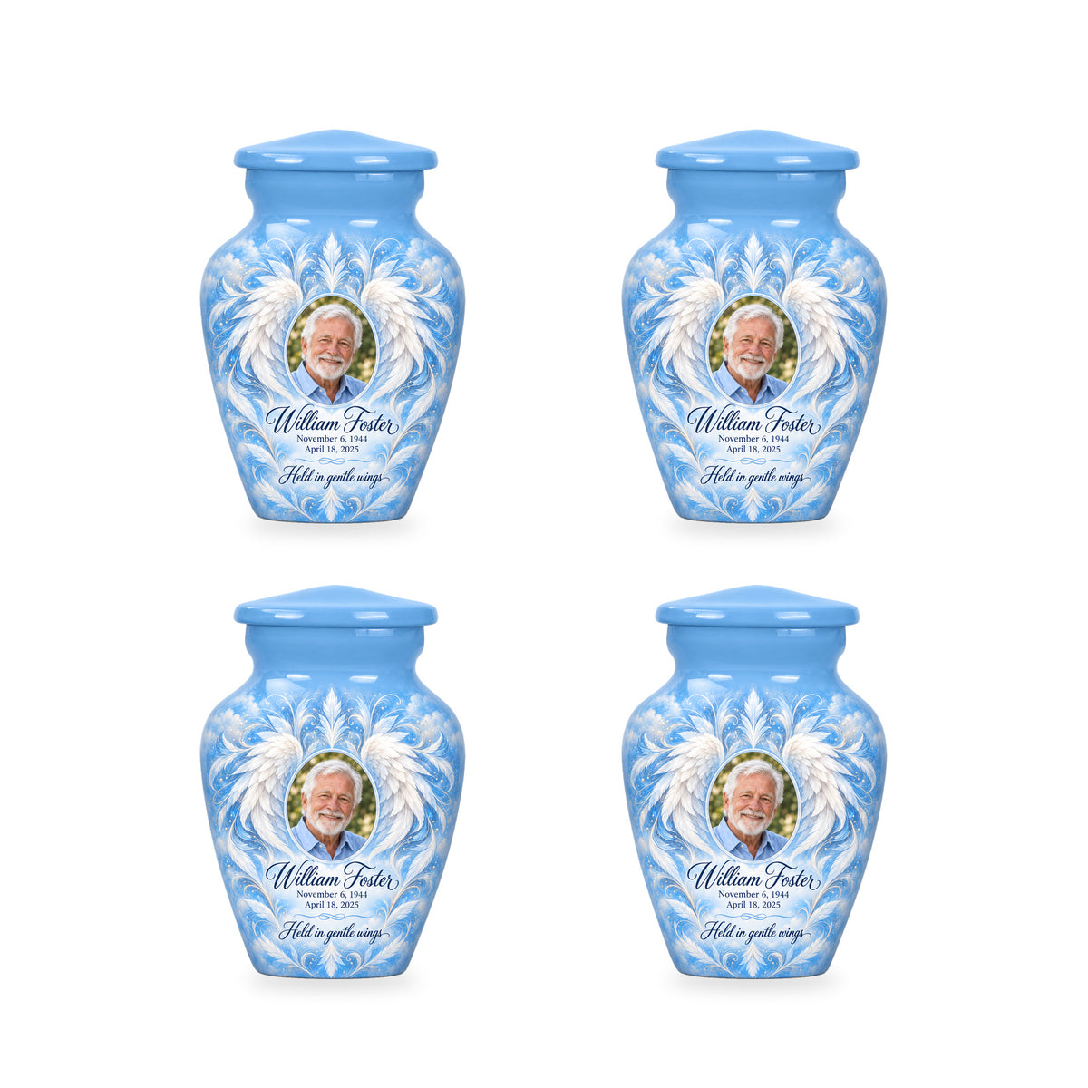 Four matching blue angel wings keepsake urns with sample photo and inscription.