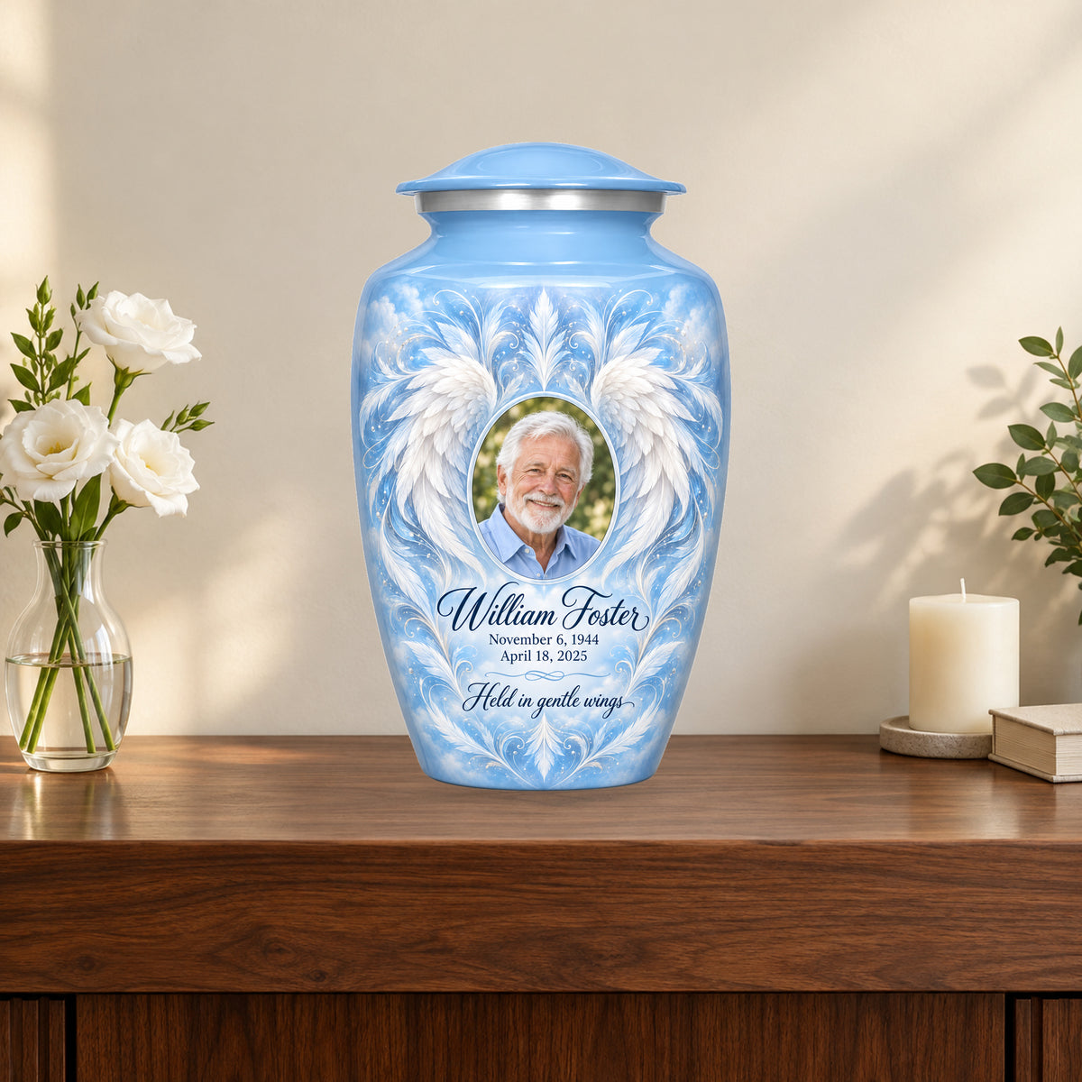 blue personalized angel wings adult urn on a memorial console.