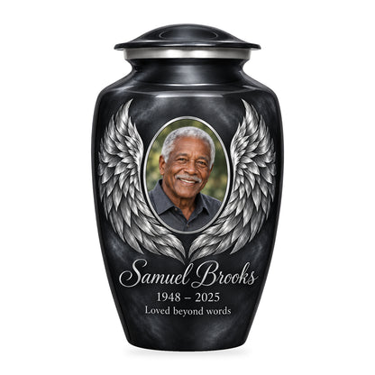 gray adult urn with Charcoal Silver Wings angel wings artwork, fictional sample portrait and personalized inscription on white.