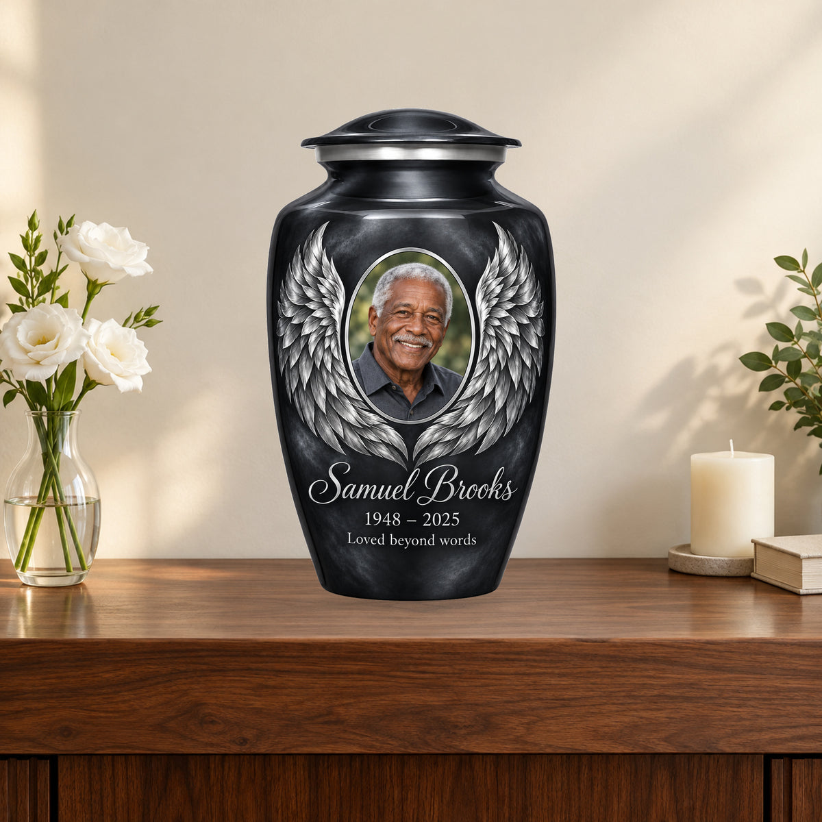 gray personalized angel wings adult urn on a memorial console.