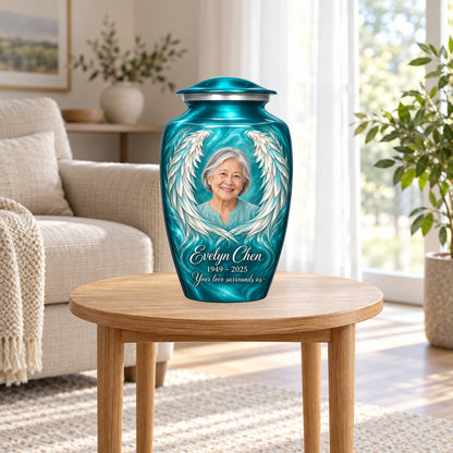 Blue personalized angel wings adult urn in a sunlit home.