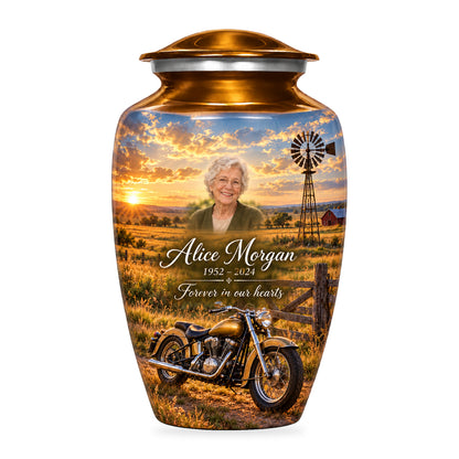 Gold adult Prairie Windmill motorcycle urn with fictional sample portrait, name and dates, shown on white.