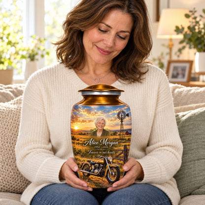 Seated person holding the adult Prairie Windmill motorcycle urn on their lap.