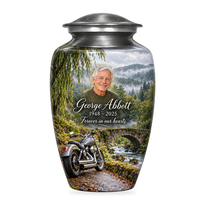 Gray adult Stonebridge Journey motorcycle urn with fictional sample portrait, name and dates, shown on white.