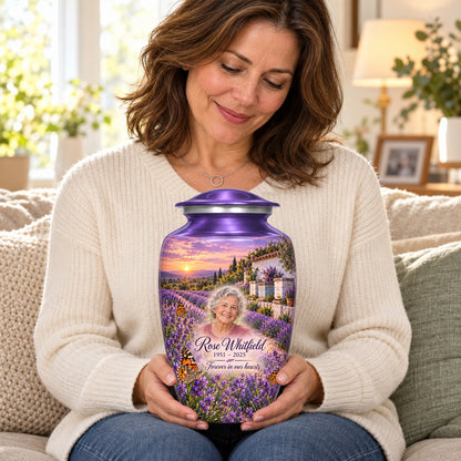 Seated person holding the adult Lavender Apiary butterfly urn on their lap.