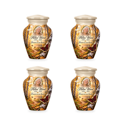 Four matching ringless Birch Dawn butterfly keepsake urns with fictional sample personalization.