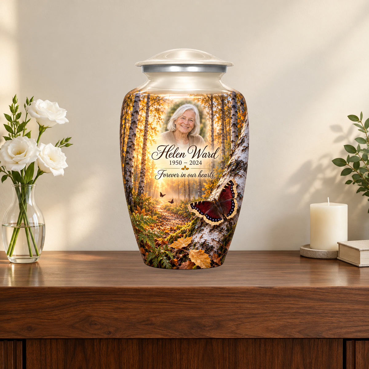 Birch Dawn personalized butterfly urn in a styled memorial display; decorative props are not included.
