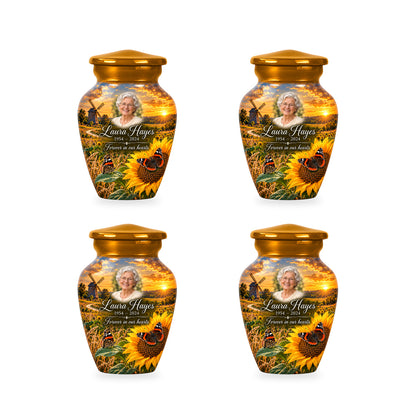 Four matching ringless Sunflower Mill butterfly keepsake urns with fictional sample personalization.