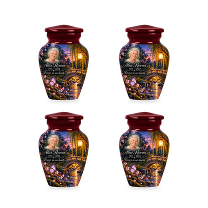 Four matching ringless Lantern Footbridge butterfly keepsake urns with fictional sample personalization.