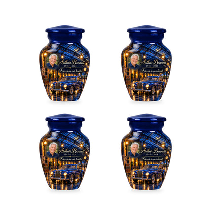Four matching ringless Rainlit Rail Depot car keepsake urns with fictional sample personalization.