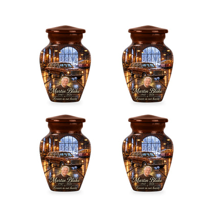 Four matching ringless Winter Tram Hall car keepsake urns with fictional sample personalization.