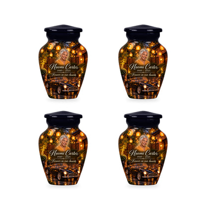 Four matching ringless Lantern Courtyard car keepsake urns with fictional sample personalization.