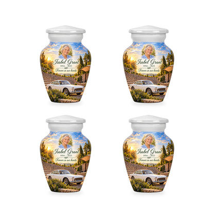 Four matching ringless Amphitheatre Morning car keepsake urns with fictional sample personalization.