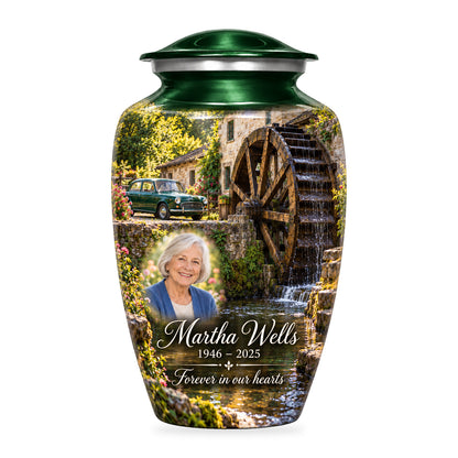 Green adult Waterwheel Courtyard car urn with fictional sample portrait, name and years, shown on white.