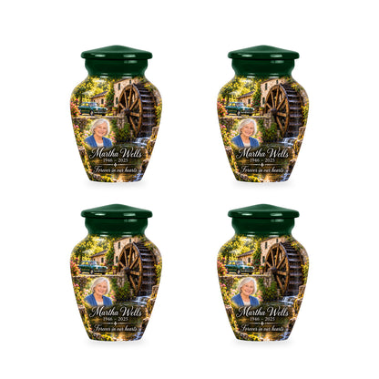 Four matching ringless Waterwheel Courtyard car keepsake urns with fictional sample personalization.