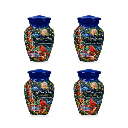 Four matching ringless Copper Rainchain cardinal keepsake urns with fictional sample personalization.