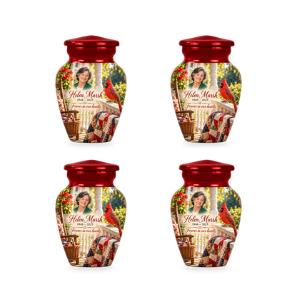 Four matching ringless Quilt Porch Morning cardinal keepsake urns with fictional sample personalization.