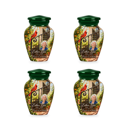 Four matching ringless Orangery Spiral Stair cardinal keepsake urns with fictional sample personalization.