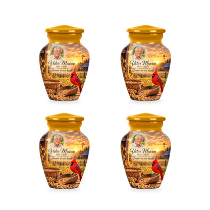 Four matching ringless Grain Yard Morning cardinal keepsake urns with fictional sample personalization.