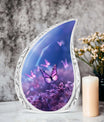 Large Butterfly urn with purple butterflies flying over a meadow design, ideal for adult female human ashes