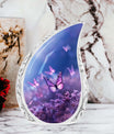 Large Butterfly urn with purple butterflies flying over a meadow design, ideal for adult female human ashes