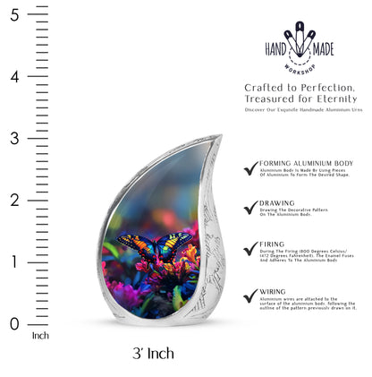 Twilight Blue Butterfly Cremation Urn angled view of lid and engraved motif - smooth teardrop contour featuring butterfly art - mini keepsake memorial for portion of cremation ashes