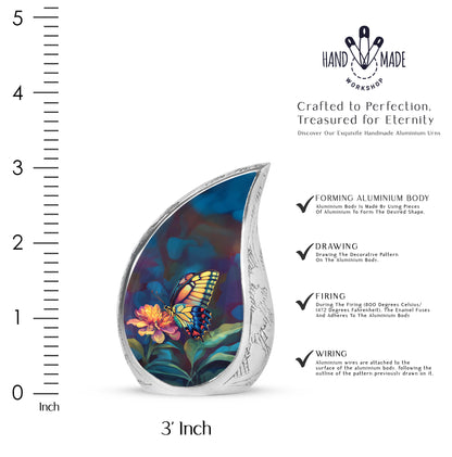 Midnight Black Butterfly Cremation Urn angled view of lid and engraved motif - graceful tear-shaped urn with butterfly motif - mini keepsake memorial for portion of cremation ashes