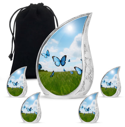 Misty Blue Butterfly Cremation Urn side profile showing urn shape - flowing teardrop butterfly silhouette on curved aluminum - memorial set with one large and four small urns