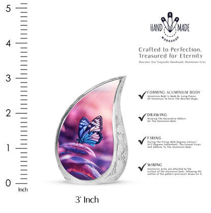 Rose Pink Butterfly Cremation Urn angled view of lid and engraved motif - flowing teardrop butterfly silhouette on curved aluminum - mini keepsake memorial for portion of cremation ashes