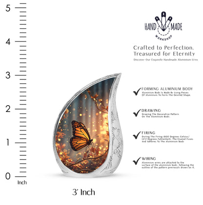 Icy Blue Butterfly Cremation Urn angled view of lid and engraved motif - rounded teardrop butterfly design with delicate detail - mini keepsake memorial for portion of cremation ashes