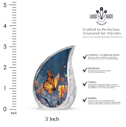 Soft Blue Butterfly Cremation Urn angled view of lid and engraved motif - smooth teardrop contour featuring butterfly art - mini keepsake memorial for portion of cremation ashes