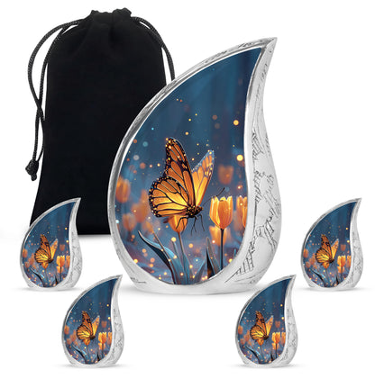 Cobalt Blue Butterfly Cremation Urn side profile showing urn shape - graceful tear-shaped urn with butterfly motif - memorial set with one large and four small urns