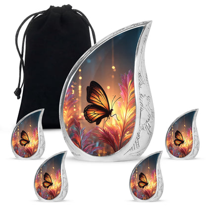 Antique Gold Butterfly Cremation Urn side profile showing urn shape - flowing teardrop butterfly silhouette on curved aluminum - memorial set with one large and four small urns