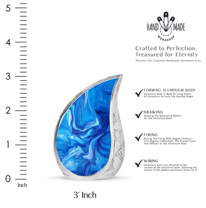Powder Blue Blue Cremation Urn angled view of lid and engraved motif - flowing teardrop blue silhouette on curved aluminum - mini keepsake memorial for portion of cremation ashes
