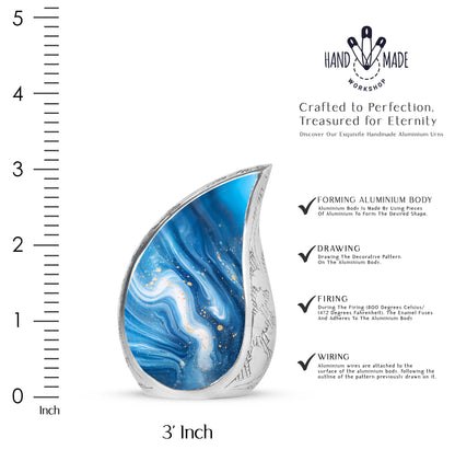 Misty Blue Blue Cremation Urn angled view of lid and engraved motif - rounded teardrop blue design with delicate detail - mini keepsake memorial for portion of cremation ashes