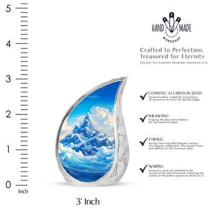 Misty Blue Blue Cremation Urn angled view of lid and engraved motif - flowing teardrop blue silhouette on curved aluminum - mini keepsake memorial for portion of cremation ashes