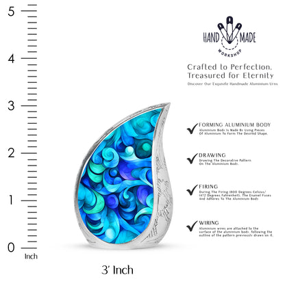 Steel Blue Blue Cremation Urn angled view of lid and engraved motif - graceful tear-shaped urn with blue motif - mini keepsake memorial for portion of cremation ashes