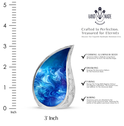 Royal Blue Blue Cremation Urn angled view of lid and engraved motif - smooth teardrop contour featuring blue art - mini keepsake memorial for portion of cremation ashes