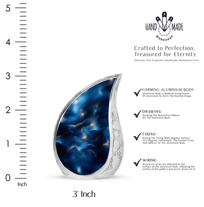 Pastel Blue Blue Cremation Urn angled view of lid and engraved motif - rounded teardrop blue design with delicate detail - mini keepsake memorial for portion of cremation ashes