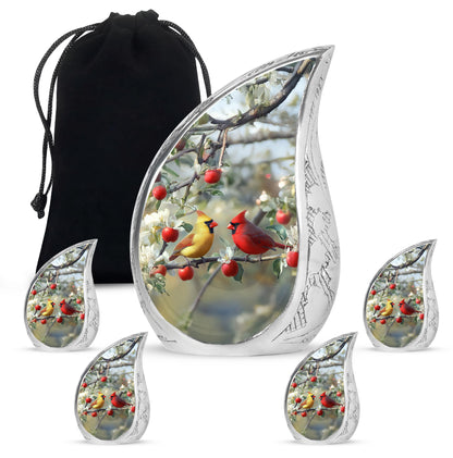 Gleaming Silver Cardinal Cremation Urn side profile showing urn shape - rounded teardrop cardinal design with delicate detail - memorial set with one large and four small urns