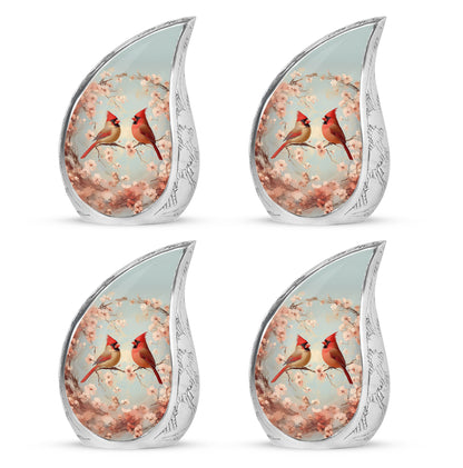 Silver Gray Cardinal Cremation Urn close-up of engraving and surface detail - flowing teardrop cardinal silhouette on curved aluminum - 10 inch aluminum urn for cremated remains