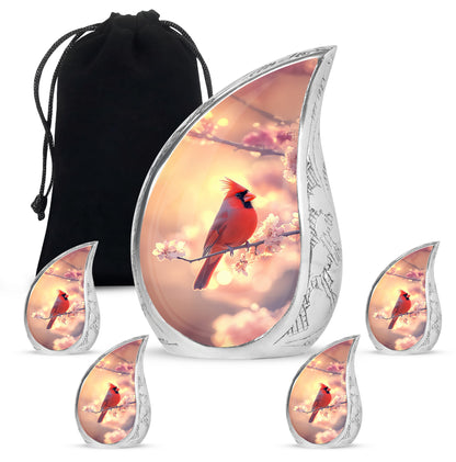 Amber Gold Cardinal Cremation Urn side profile showing urn shape - flowing teardrop cardinal silhouette on curved aluminum - memorial set with one large and four small urns
