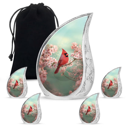 Verdant Green Cardinal Cremation Urn side profile showing urn shape - rounded teardrop cardinal design with delicate detail - memorial set with one large and four small urns